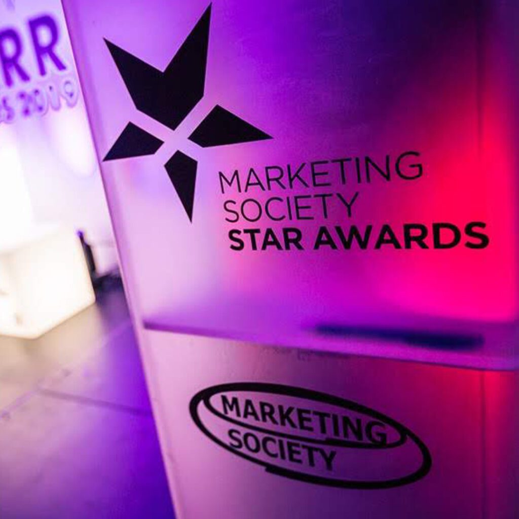 Neon-lit event banner saying Marketing Society Star Awards.