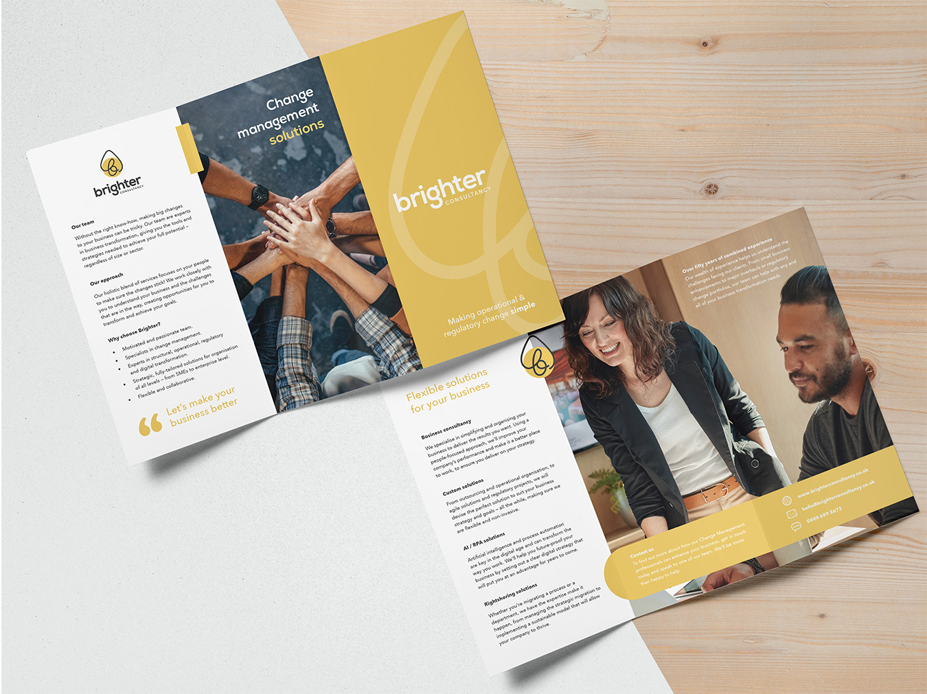 A top-down photo of two sides of a trifold brochure, showcasing Brighter Consultancy's services.